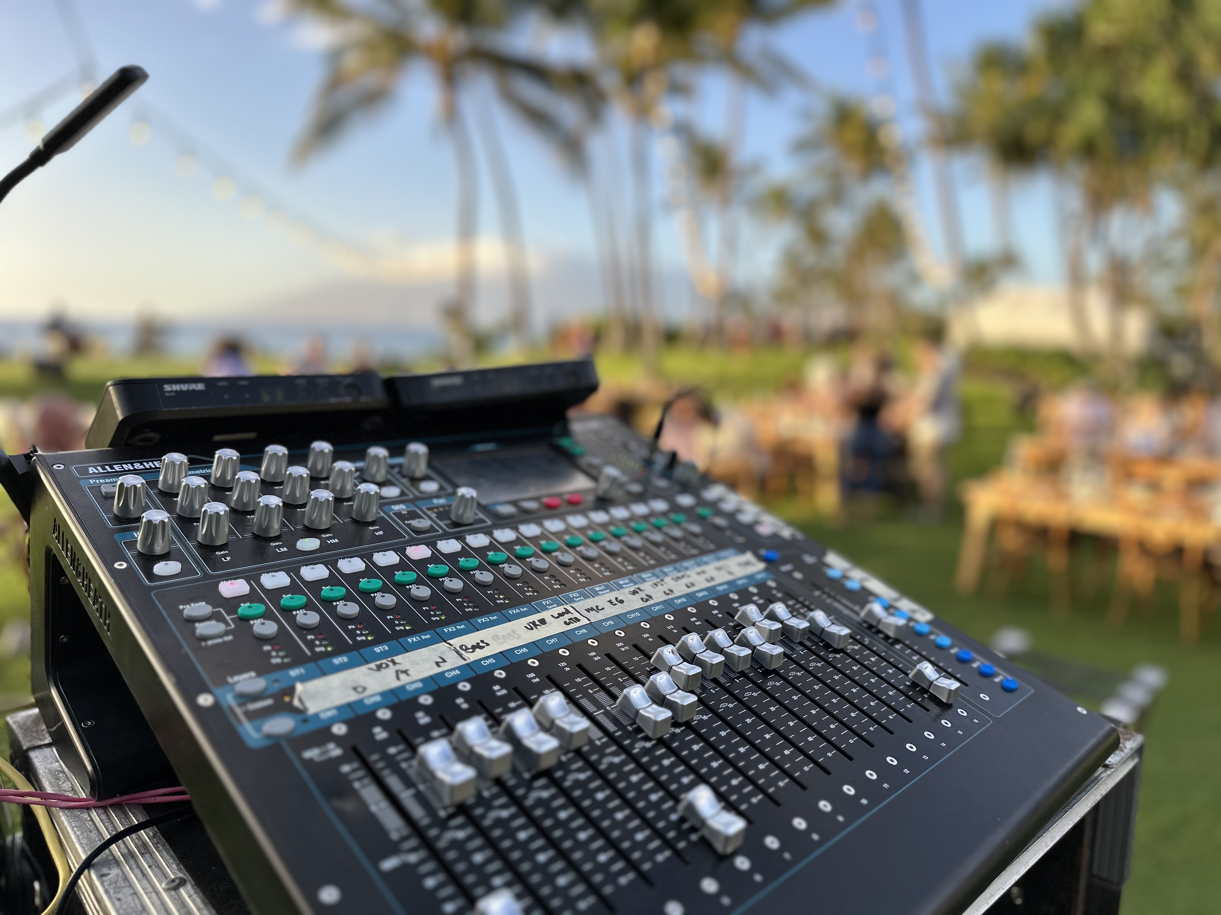Compact audio mixing console with faders and display during live event sound control